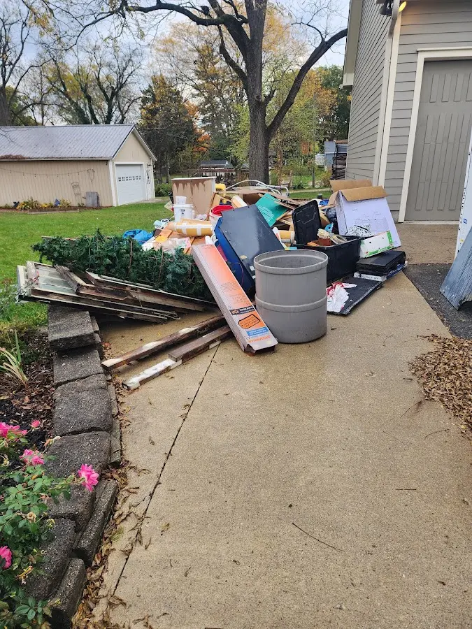 Dumpster being loaded with debris for Estate Cleanout Dumpster Rental in Collingswood